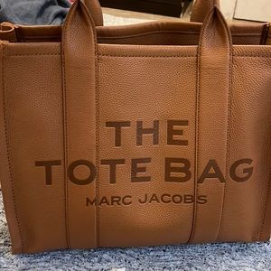 Marc Jacobs large handbag (argan oil) along with purse organizer. Good condition
